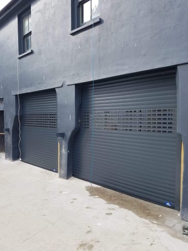 Part punched and part solid roller shutter
