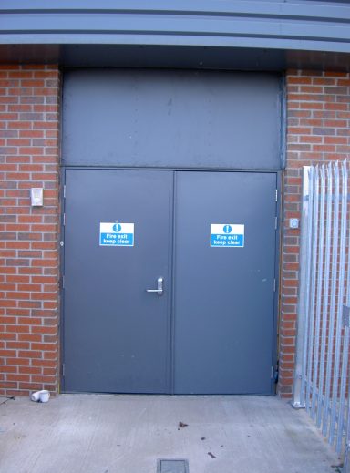 Steel door set with panel above