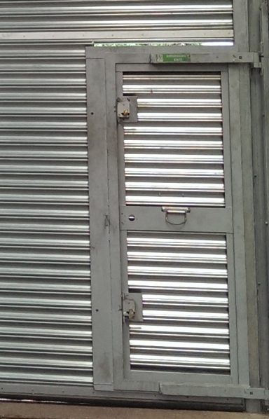 Roller shutter with door